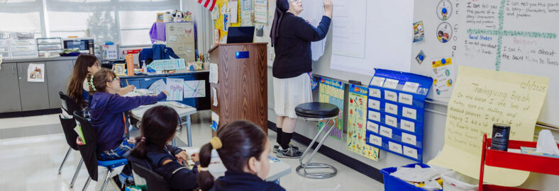 St. Ignatius teacher writing on board